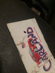 It is not possible to identify an insect from the provided image. The image shows a damaged sign or piece of paper with the words 'CARLAND QUALITY USED CARS' and a graphic of a car. There is no visible insect in the image.